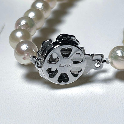 Aoya pearl necklace with 6.4-6.8mm white Akoya pearls and silver Teri wrap, 42.5 cm length