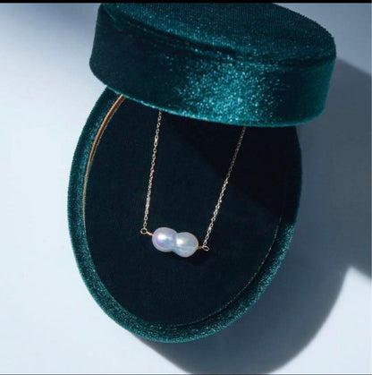 Twin Akoya pearl necklace with 10K gold chain and deep sea-inspired design