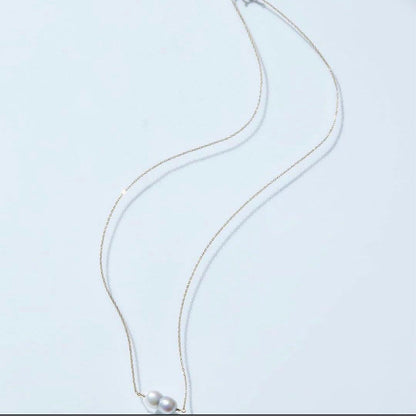 Twin Akoya pearl necklace with 10K gold chain and deep sea-inspired design