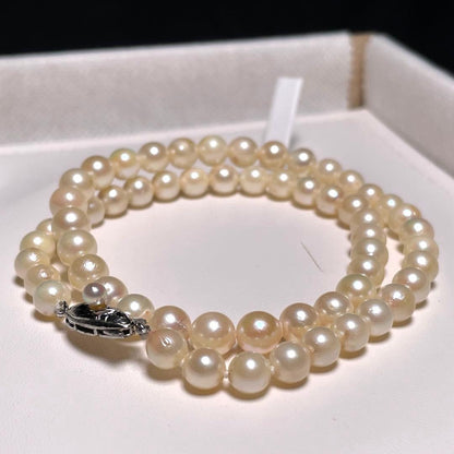 Akoya pearl necklace with 5.8-6.8mm round white pearls on a 16 inch silver chain