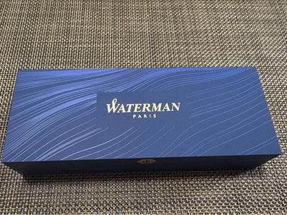 Waterman black ballpoint pen shown with its dedicated black case on a white background