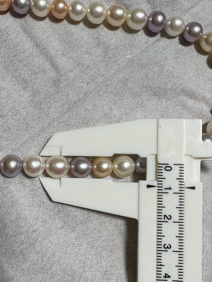 Tasaki multi-color pearl necklace with pearls in white, cream, beige, and purple gray, 42 cm length