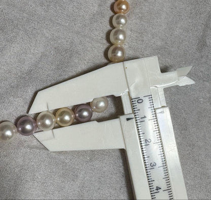 Tasaki multi-color pearl necklace with pearls in white, cream, beige, and purple gray, 42 cm length