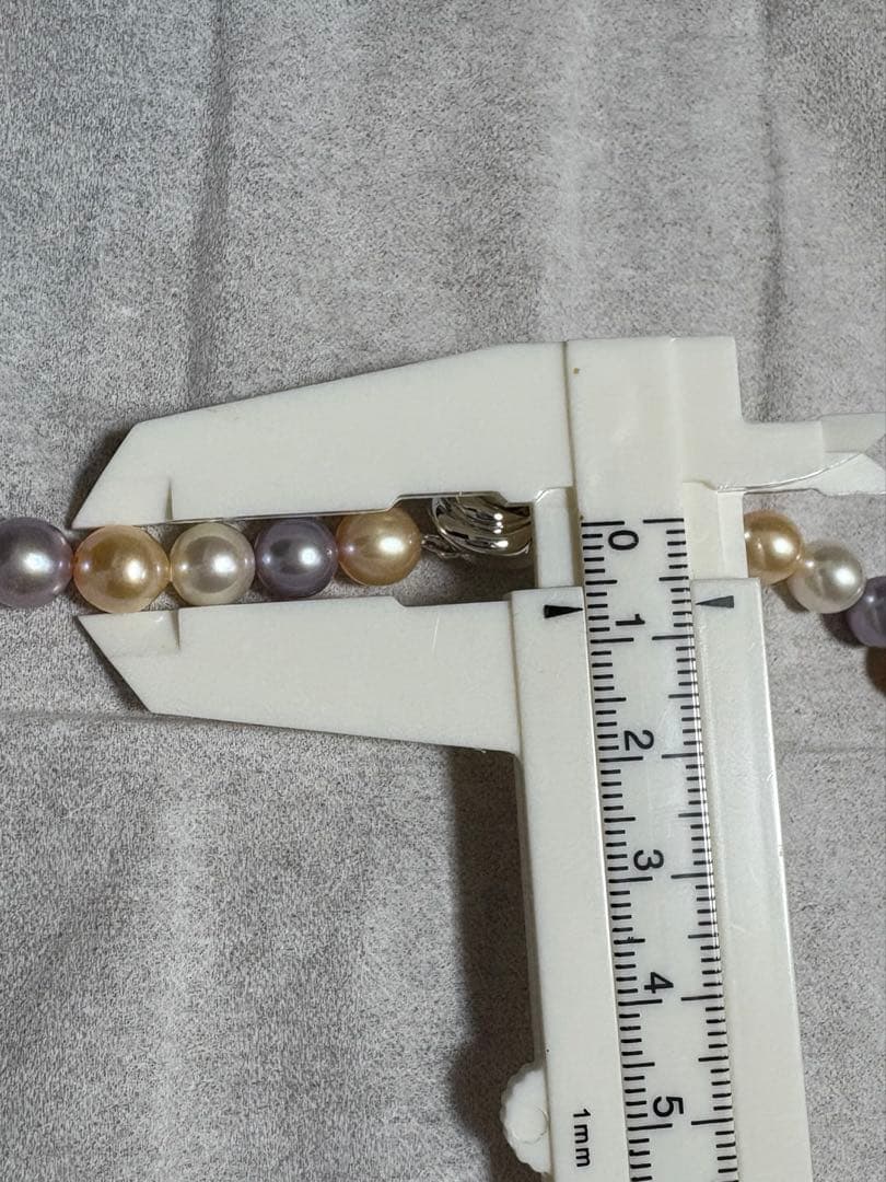 Tasaki multi-color pearl necklace with pearls in white, cream, beige, and purple gray, 42 cm length