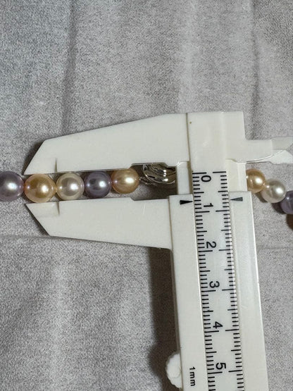 Tasaki multi-color pearl necklace with pearls in white, cream, beige, and purple gray, 42 cm length