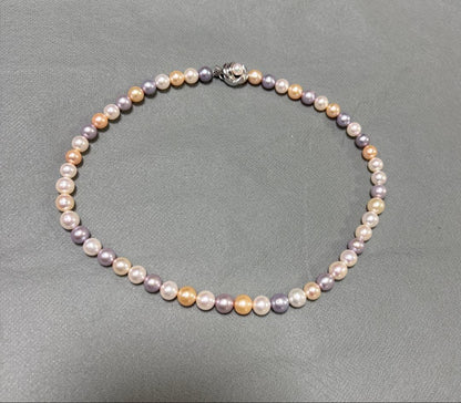 Tasaki multi-color pearl necklace with pearls in white, cream, beige, and purple gray, 42 cm length