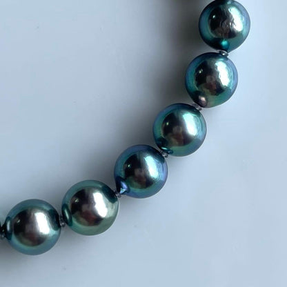 Akoya Pearl Black Necklace with 7.5-8mm pearls and silver clasp displayed on white background