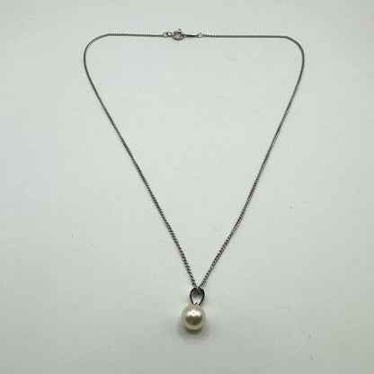 TASAKI silver necklace with single pearl pendant and 40 cm chain displayed with case
