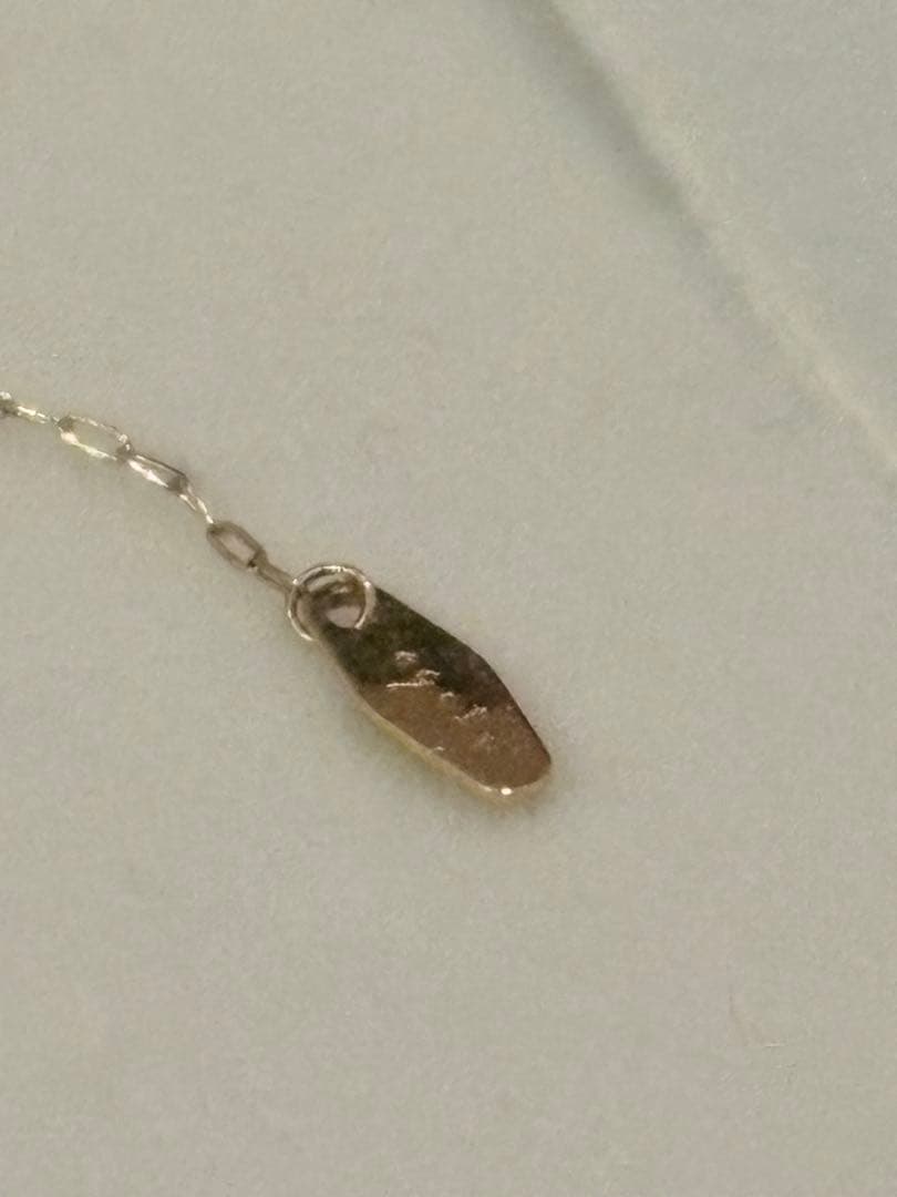 agete diamond necklace with 0.1CT carat weight crafted in K18 gold on a white background