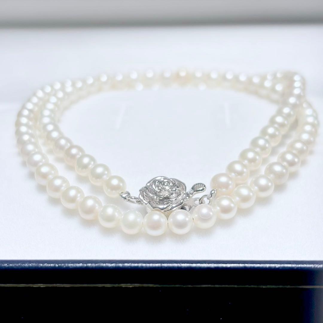 Baby Pearl Akoya genuine pearl necklace with 4.5mm pearls and silver fittings on a white background