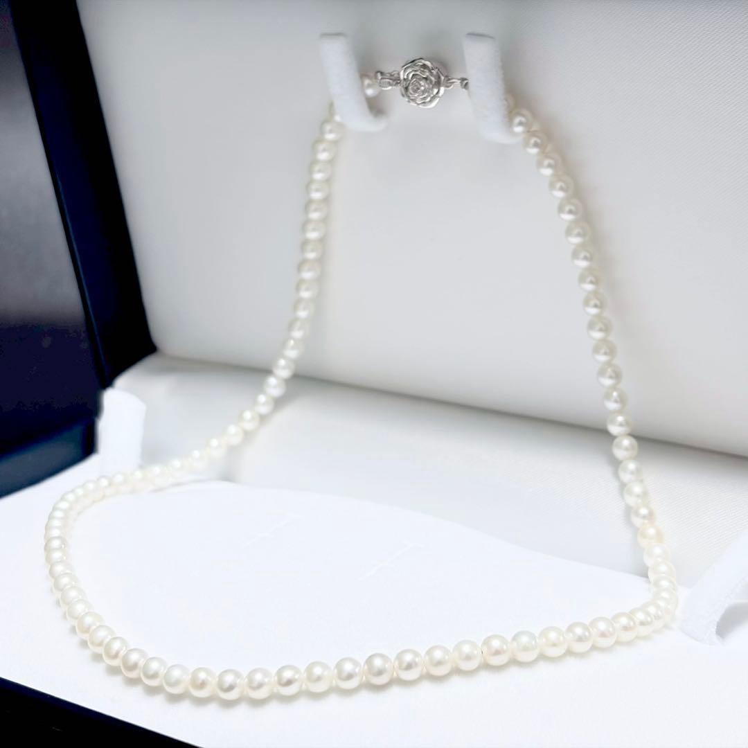 Baby Pearl Akoya genuine pearl necklace with 4.5mm pearls and silver fittings on a white background