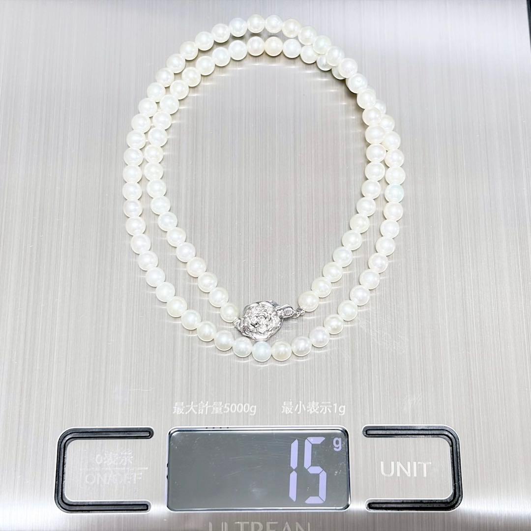 Baby Pearl Akoya genuine pearl necklace with 4.5mm pearls and silver fittings on a white background