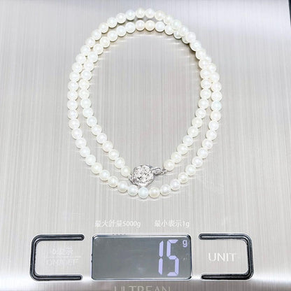 Baby Pearl Akoya genuine pearl necklace with 4.5mm pearls and silver fittings on a white background