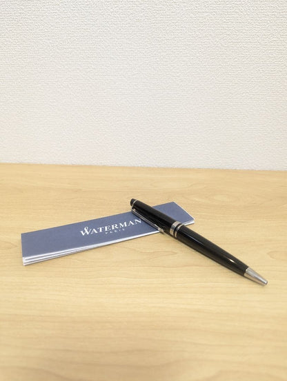 Waterman black and silver ballpoint pen with oil-based ink in a protective case with instruction manual
