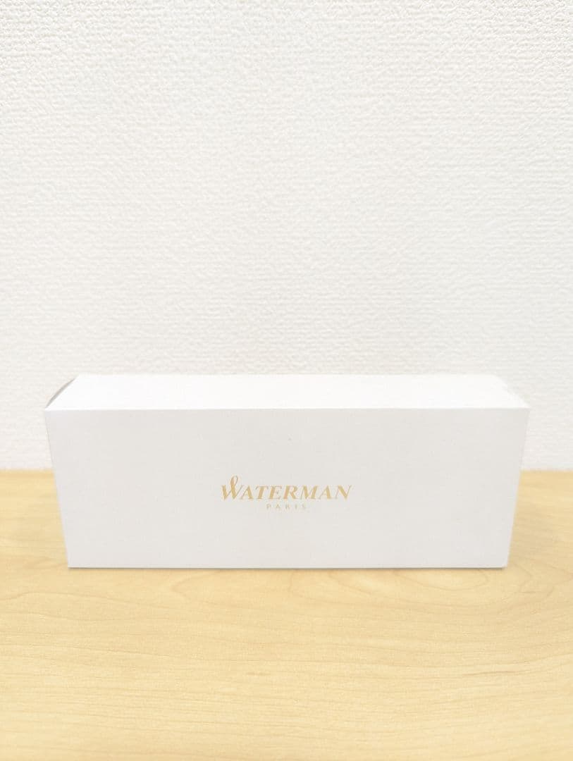 Waterman black and silver ballpoint pen with oil-based ink in a protective case with instruction manual