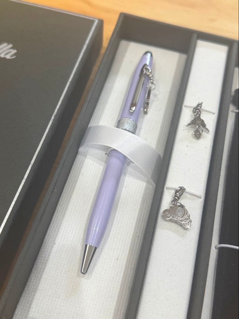 Cinderella Cross ballpoint pen in black with silver accents wrapped in protective pouch