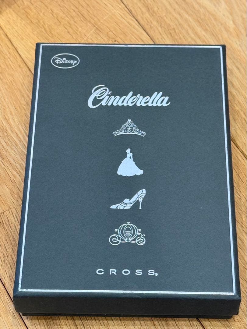 Cinderella Cross ballpoint pen in black with silver accents wrapped in protective pouch