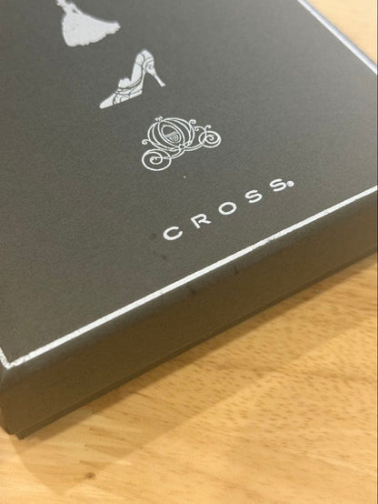 Cinderella Cross ballpoint pen in black with silver accents wrapped in protective pouch