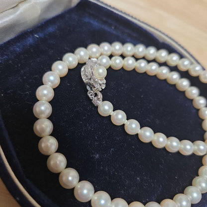 Elegant Akoya pearl necklace with white round pearls arranged in a single strand