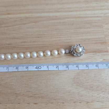 Elegant Akoya pearl necklace with white round pearls arranged in a single strand