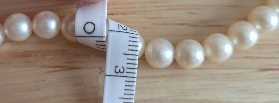 Elegant Akoya pearl necklace with white round pearls arranged in a single strand
