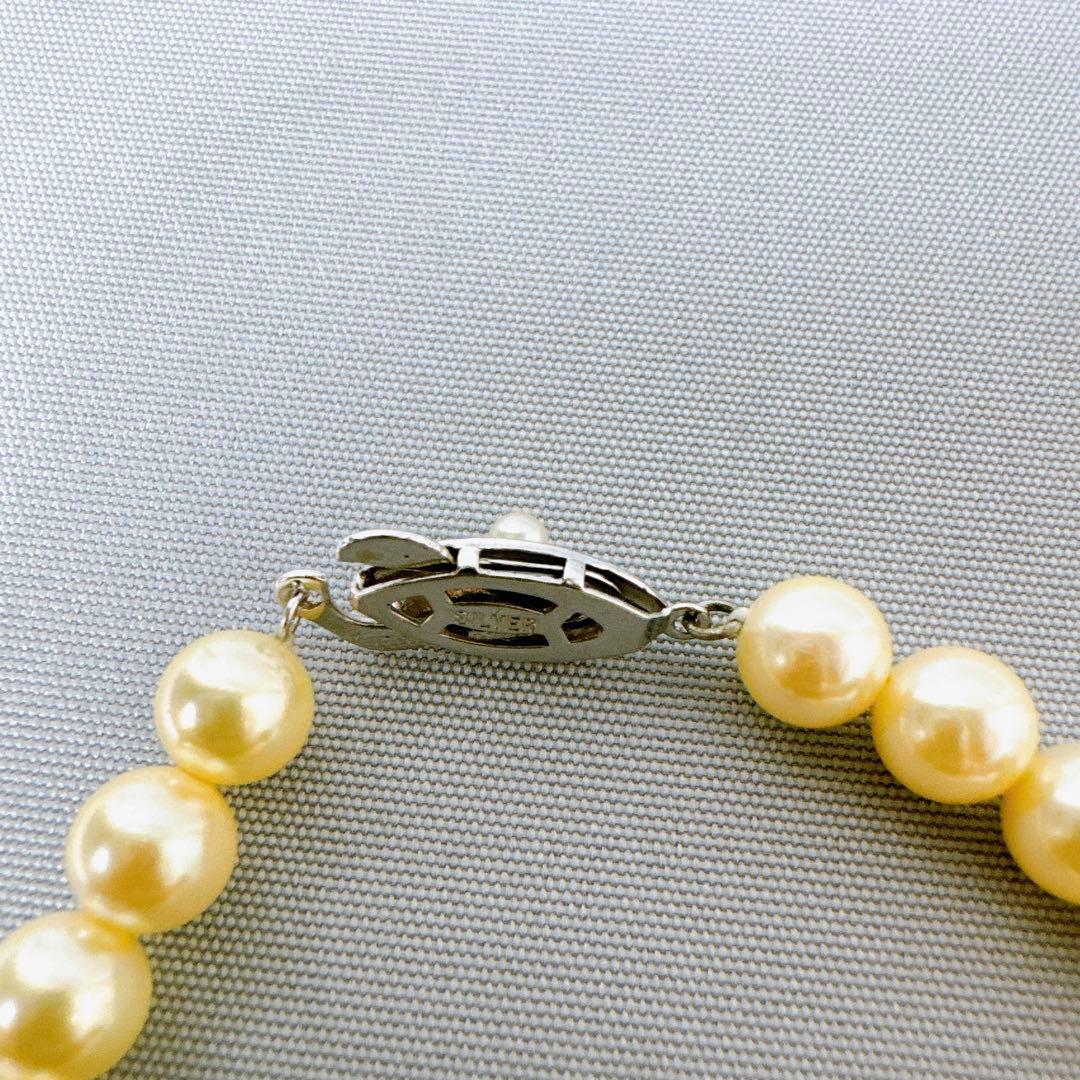Honpa Akoya pearl necklace with 7mm round pearls and silver clasp, approximately 46cm long