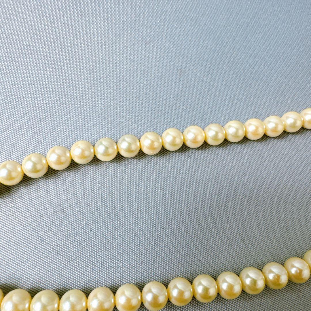 Honpa Akoya pearl necklace with 7mm round pearls and silver clasp, approximately 46cm long