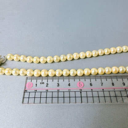 Honpa Akoya pearl necklace with 7mm round pearls and silver clasp, approximately 46cm long