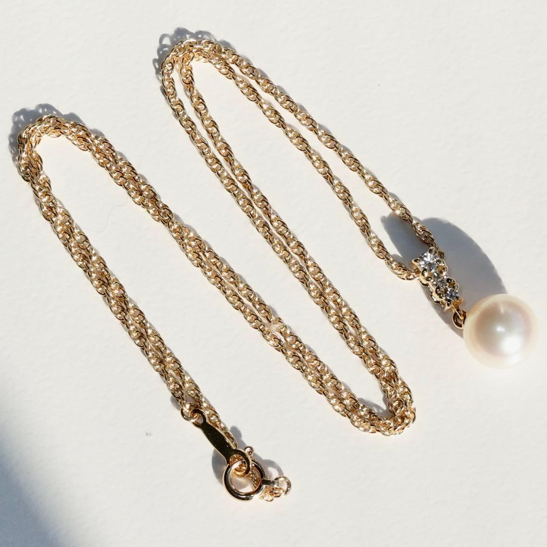 K18 yellow gold Mikimoto necklace featuring 8 mm Akoya pearl and diamond pendant measuring 1.7 cm by 0.84 cm