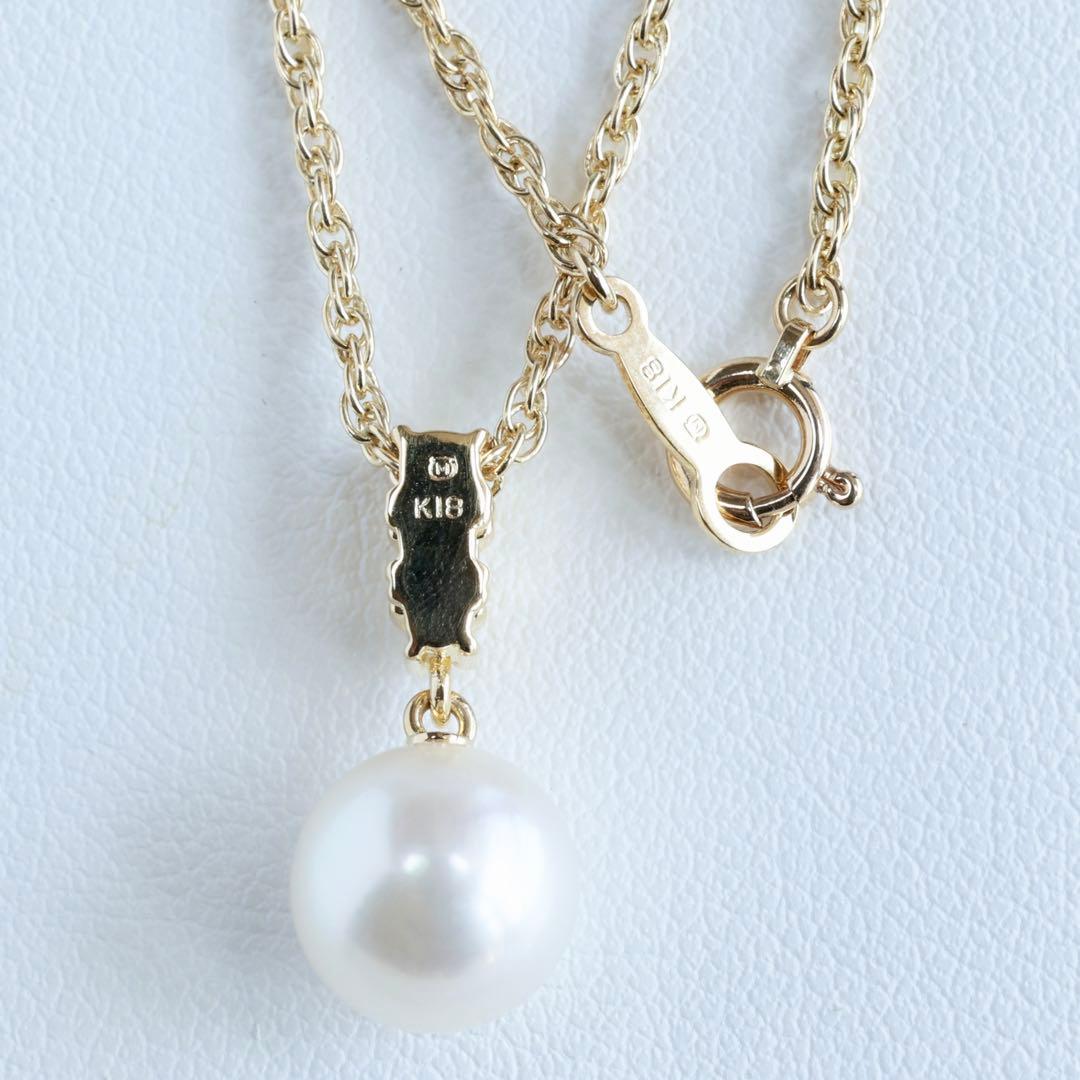 K18 yellow gold Mikimoto necklace featuring 8 mm Akoya pearl and diamond pendant measuring 1.7 cm by 0.84 cm