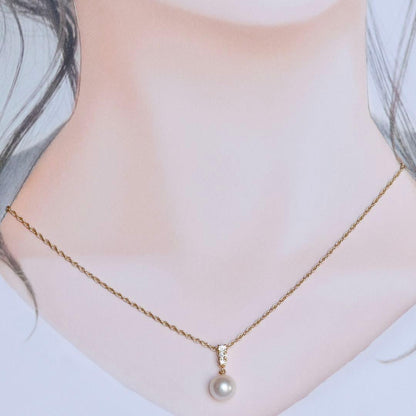 K18 yellow gold Mikimoto necklace featuring 8 mm Akoya pearl and diamond pendant measuring 1.7 cm by 0.84 cm