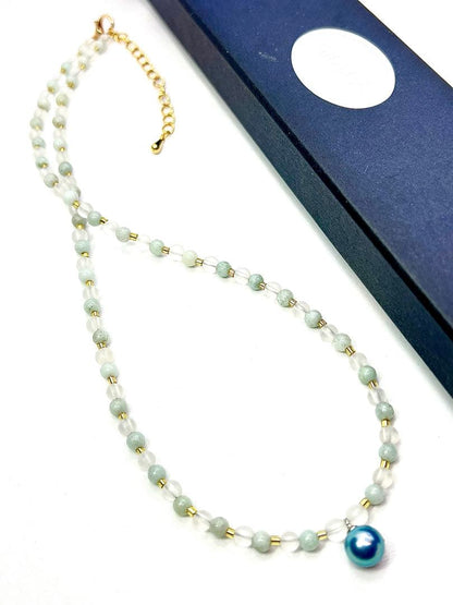Akoya pearl necklace featuring black pearls, indigo blue pearls, and amazonite beads with adjustable length