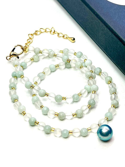 Akoya pearl necklace featuring black pearls, indigo blue pearls, and amazonite beads with adjustable length