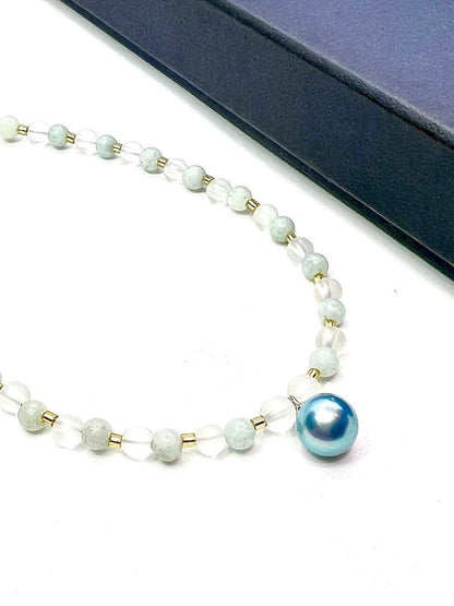 Akoya pearl necklace featuring black pearls, indigo blue pearls, and amazonite beads with adjustable length