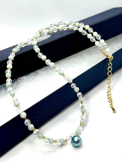 Akoya pearl necklace featuring black pearls, indigo blue pearls, and amazonite beads with adjustable length