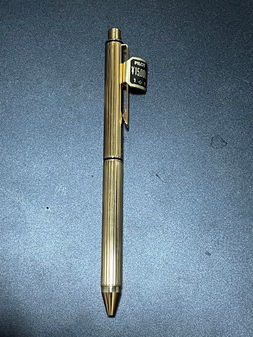 PILOT Mechanical Pencil Ballpoint Pen in gold color lying on a white background