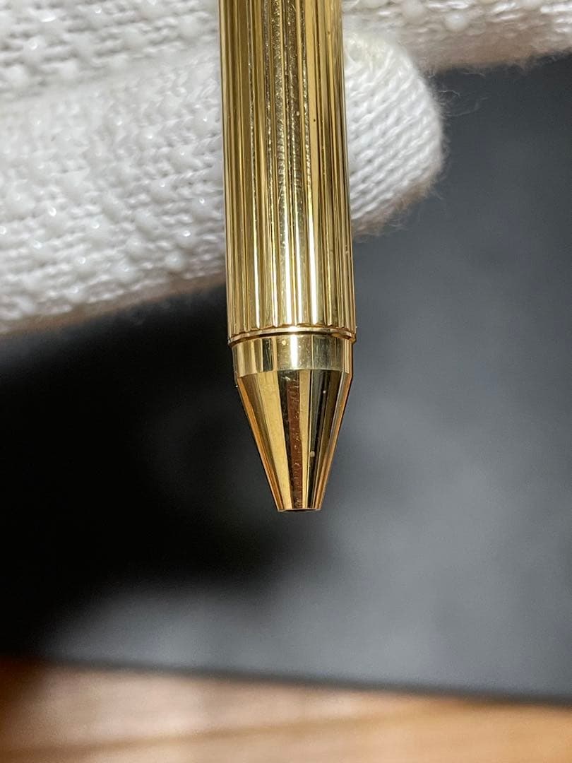 PILOT Mechanical Pencil Ballpoint Pen in gold color lying on a white background