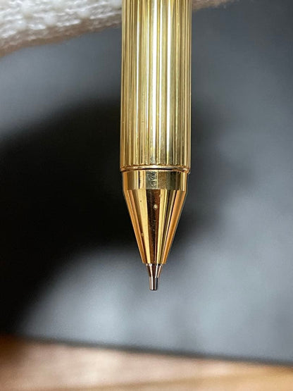 PILOT Mechanical Pencil Ballpoint Pen in gold color lying on a white background