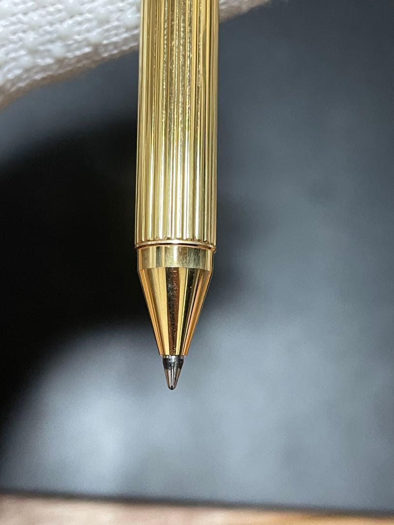 PILOT Mechanical Pencil Ballpoint Pen in gold color lying on a white background