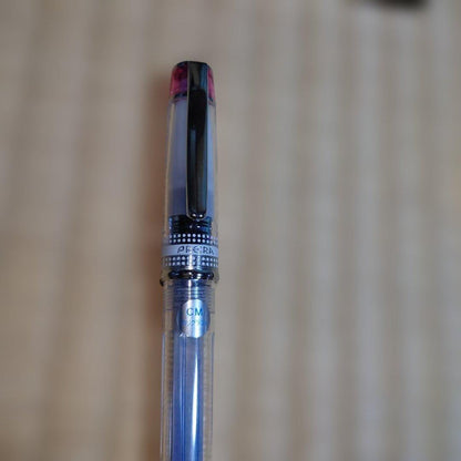 PILOT Prera Transparent Pink fountain pen with CM nib for calligraphy, shown used with visible wear