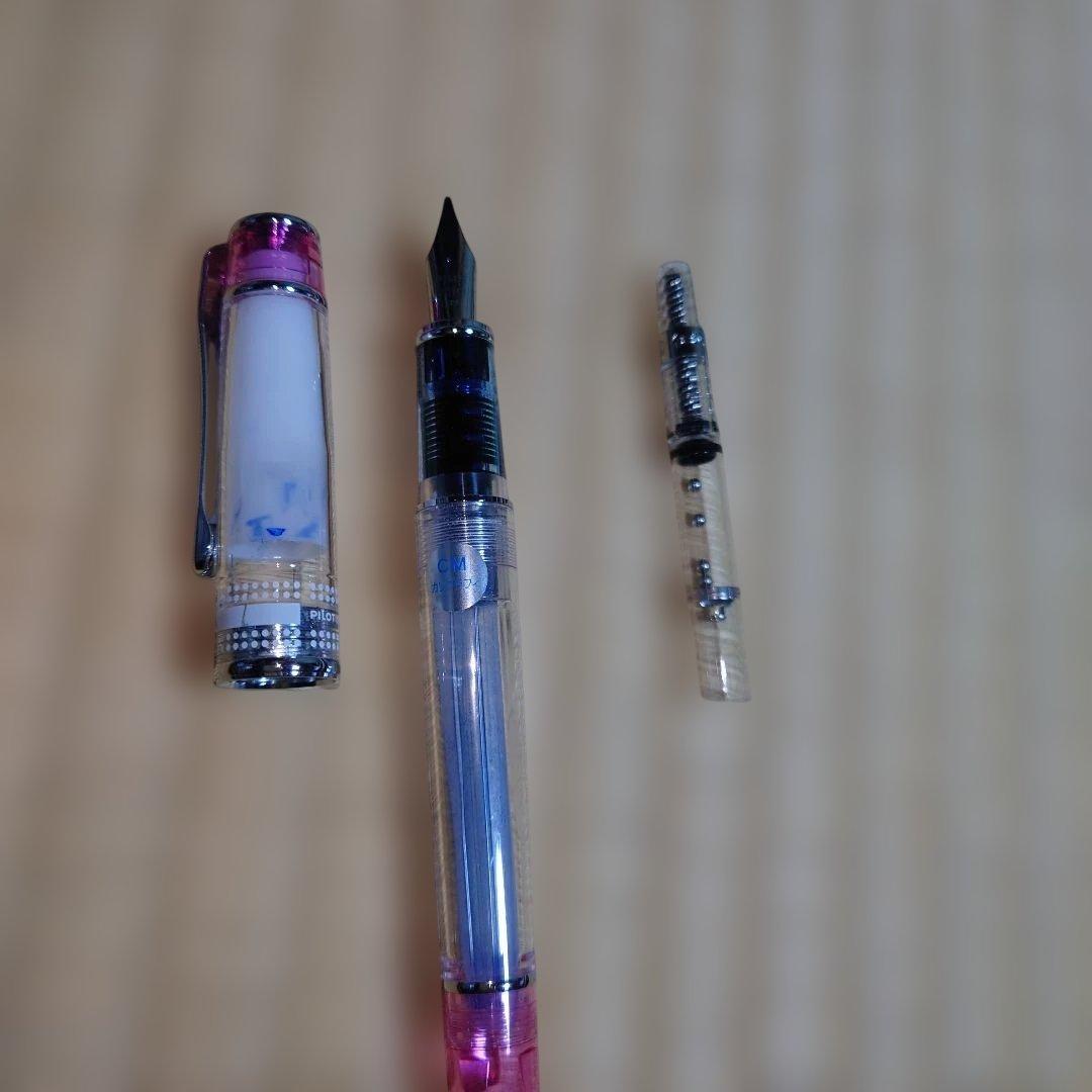 PILOT Prera Transparent Pink fountain pen with CM nib for calligraphy, shown used with visible wear