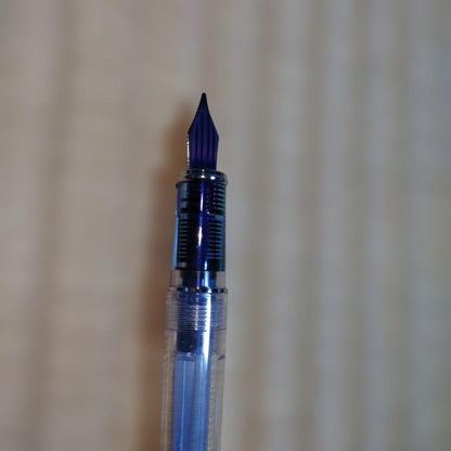 PILOT Prera Transparent Pink fountain pen with CM nib for calligraphy, shown used with visible wear