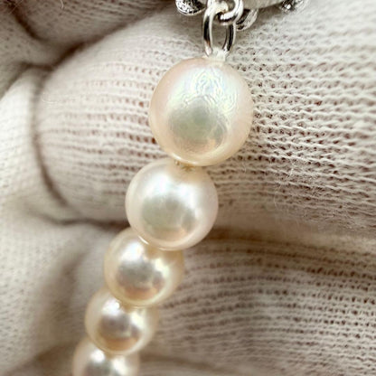 Akoya pearl necklace with 7mm pearls on a 42cm chain, styled for entrance ceremony and graduation events