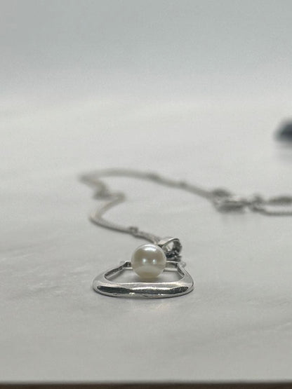 Mikimoto Akoya pearl single pearl necklace pendant in silver with horseshoe design and 5.2 mm pearl