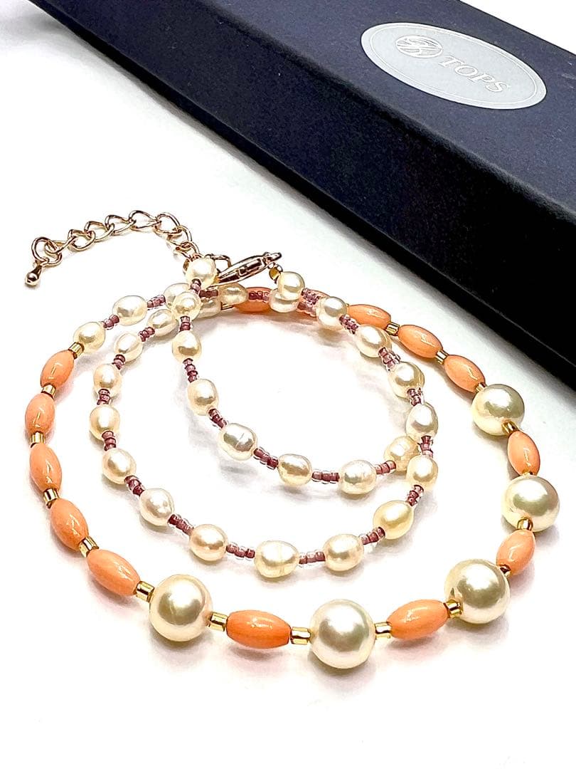 Akoya pearl and pink coral genuine pearl gold necklace with adjustable length and varying bead sizes