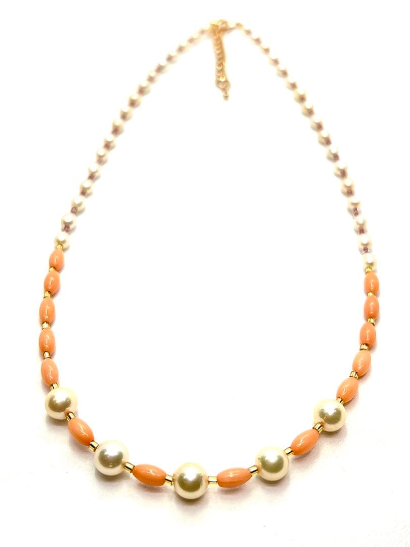 Akoya pearl and pink coral genuine pearl gold necklace with adjustable length and varying bead sizes