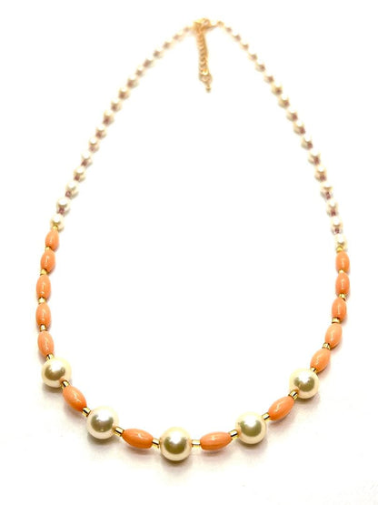 Akoya pearl and pink coral genuine pearl gold necklace with adjustable length and varying bead sizes