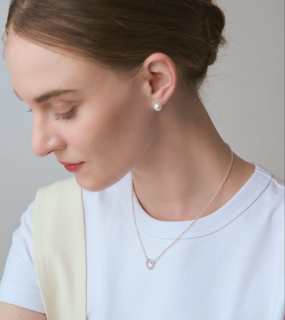 agete silver diamond necklace with a single sparkling diamond on delicate chain