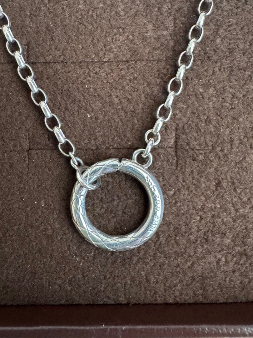 agete silver diamond necklace with a single sparkling diamond on delicate chain