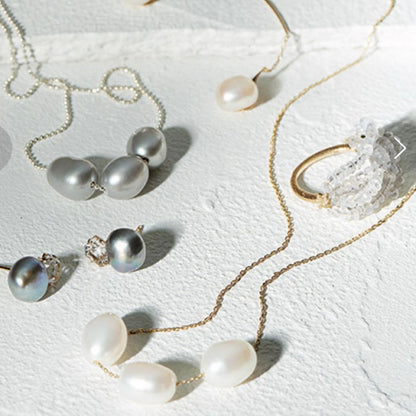 agete K10 pearl necklace featuring 3 round and elongated baroque pearls with adjustable sliding chain